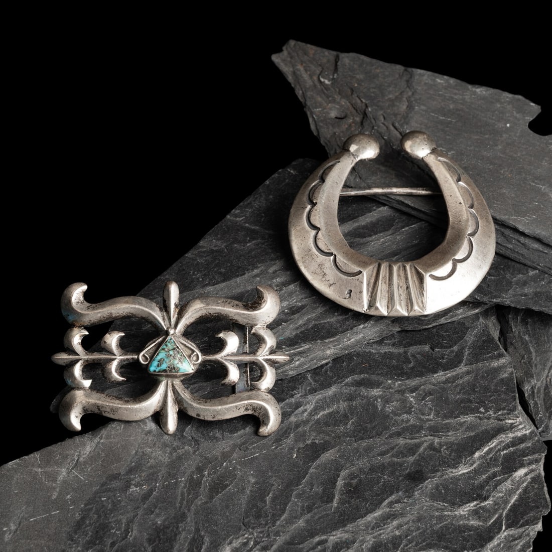 Pair of Navajo Sandcast Silver Belt Buckles: Pair of Navajo Sandcast Silver Belt Buckles mid-20th century lot of 2, neither are marked, includes: an example in the shape of a naja height 2-3/4 inches x width 3 inches belt width 1-1/2 inches,