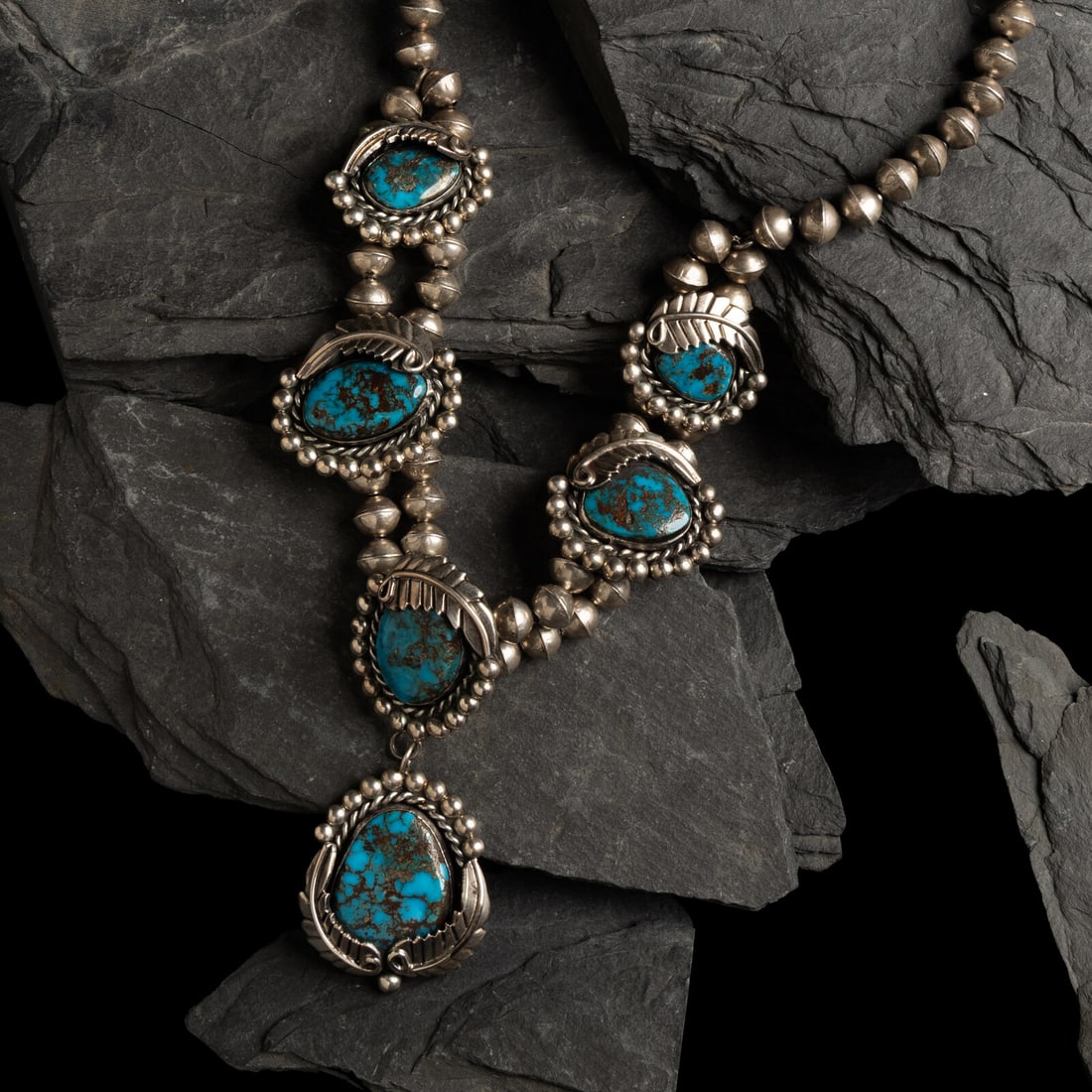 Navajo Turquoise and Silver Choker Necklace: Navajo Turquoise and Silver Choker Necklace third quarter 20th century not marked length 16-3/4 inches drop length 10 inches weight 70.9 dwt. This lot is located in Chicago.