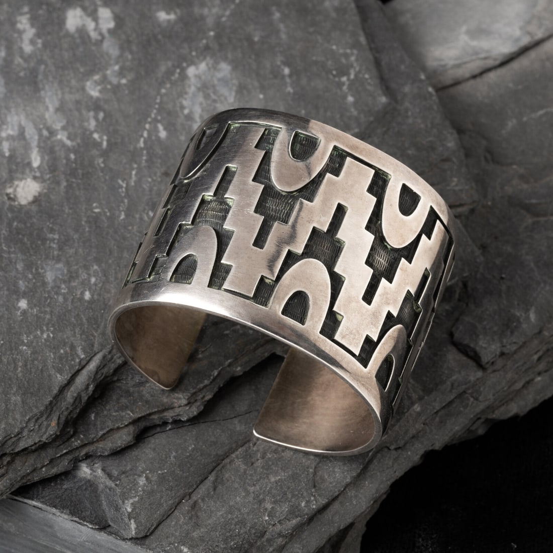 Steven Sockyma (Hopi, 20th century) Silver Overlay Cuff Bracelet: Steven Sockyma (Hopi, 20th century) Silver Overlay Cuff Bracelet marked with a conjoined SS and HC for Hopi Crafts width 2 inches interior circumference 5-1/2 inches + gap length 3/4 inch weight 84.1 