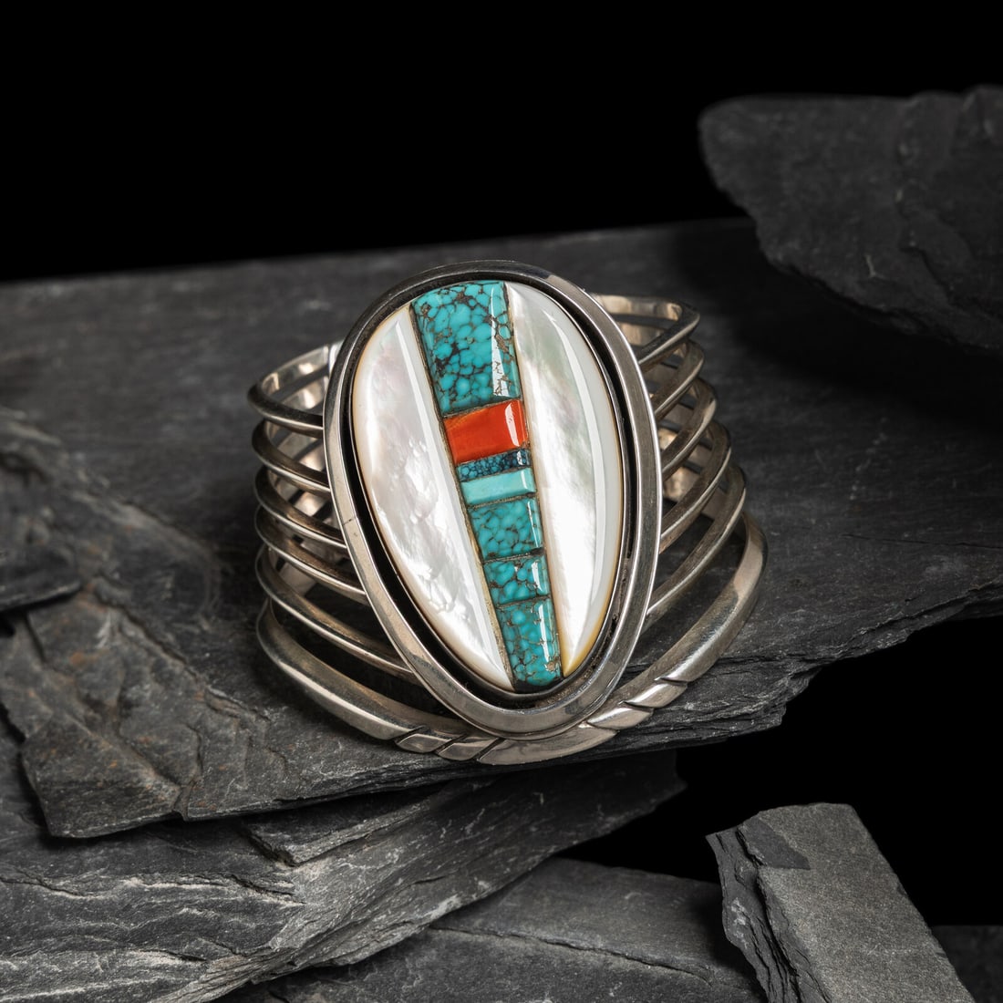 Victor Beck (DinÈ, 1941-2022) Turquoise, Coral, and Mother of Pearl Silver Cuff Bracelet: Victor Beck (DinÈ, 1941-2022) Turquoise, Coral, and Mother of Pearl Silver Cuff Bracelet signed VICTOR BECK width 2-1/2 inches interior circumference 5-1/4 inches + gap length 3/4 inch tapers to 