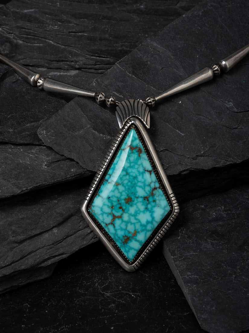 Mary Marie Yazzie (DinÈ, b. 1943) Silver and Kingman Turquoise Necklace: Mary Marie Yazzie (DinÈ, b. 1943) Silver and Kingman Turquoise Necklace signed MARY MARIE? necklace length 22-1/2 inches pendant length 3-1/4 inches x width 1-7/8 inches weight 47.4 dwt. This lot