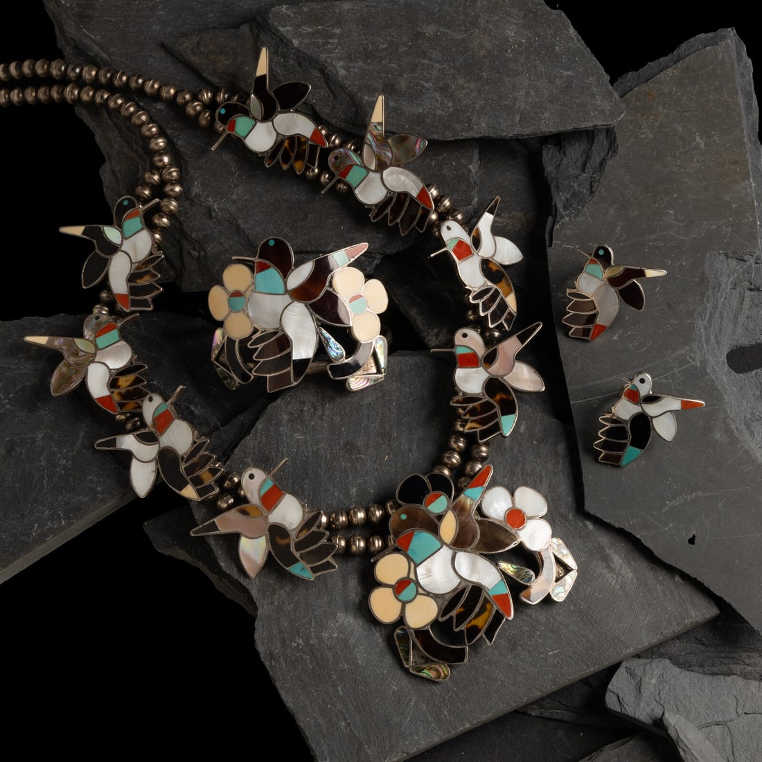 Bobby and Corraine Shack (Zuni, 20th century) Channel Inlay Hummingbird Squash Blossom Suite (1 of 2)