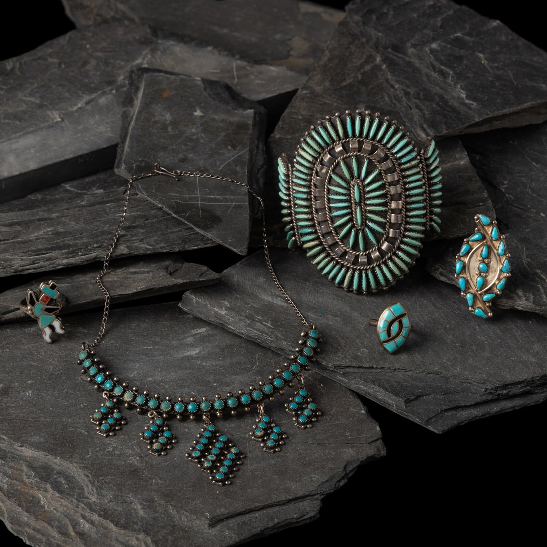 Navajo and Zuni Jewelry: Navajo and Zuni Jewelry second half 20th century lot of 5, includes: a silver and petit point turquoise necklace, marked STERLING length 12 inches drop length 7-3/4 inches weight 18.6 dwt. a silver an