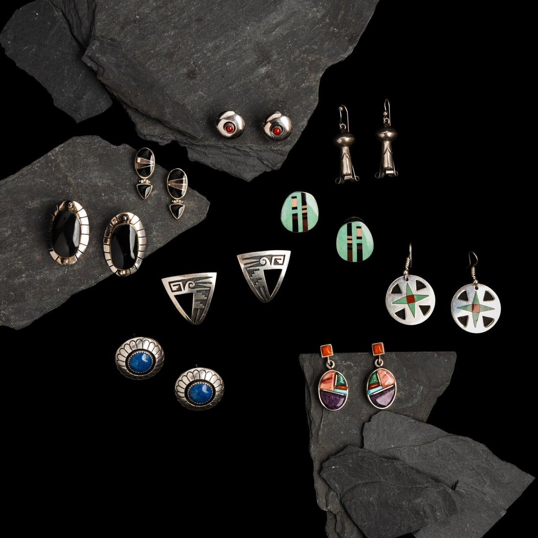 An Assortment Of Navajo, Hopi, Zuni, and Mexican Earrings: An Assortment Of Navajo, Hopi, Zuni, and Mexican Earrings second half 20th century lot of 9 pairs, includes: a pair of unmarked silver squash blossom hook earrings length 1-3/4 inches (each) combined