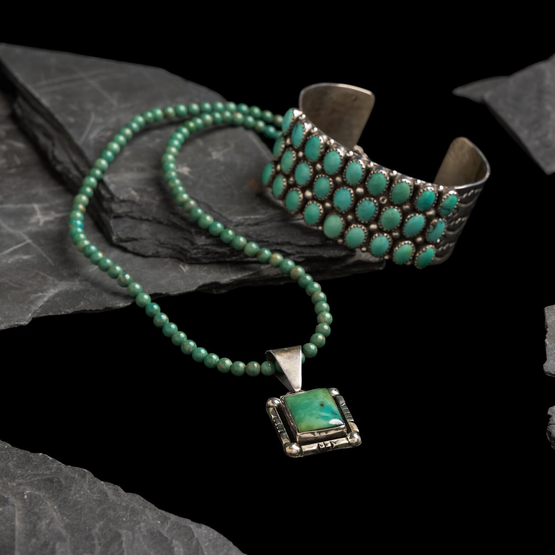 Navajo Sterling Silver and Turquoise Cuff Bracelet and Necklace: Navajo Sterling Silver and Turquoise Cuff Bracelet and Necklace late 20th century lot of 2, includes: a cuff with stamped shank and set with three rows of 27 cabochons; marked STERLING and signed C.