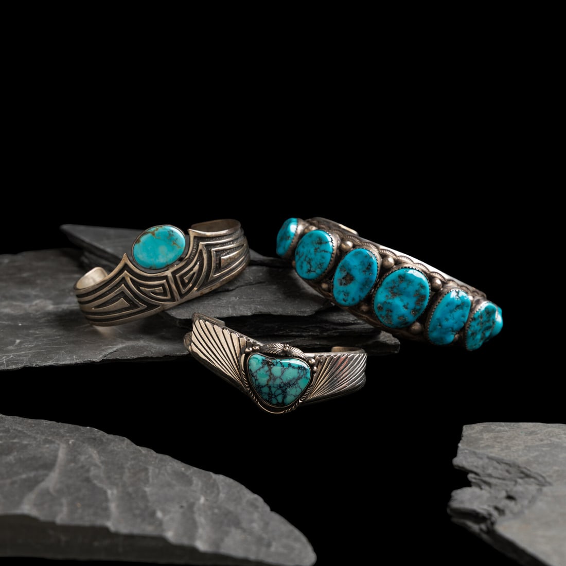 Navajo and Southwestern-style Sterling Silver and Turquoise Cuff Bracelets: Navajo and Southwestern-style Sterling Silver and Turquoise Cuff Bracelets second half 20th century lot of 3, includes: a heavy cuff set with a row of seven graduated stones; marked R STERLING width 1
