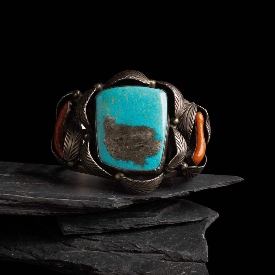 Navajo Silver, Turquoise, and Coral Cuff Bracelet: Navajo Silver, Turquoise, and Coral Cuff Bracelet third quarter 20th century marked with an arrow hallmark on the terminal width 2-3/8 inches interior circumference 5-3/4 inches + gap length 1-1/8