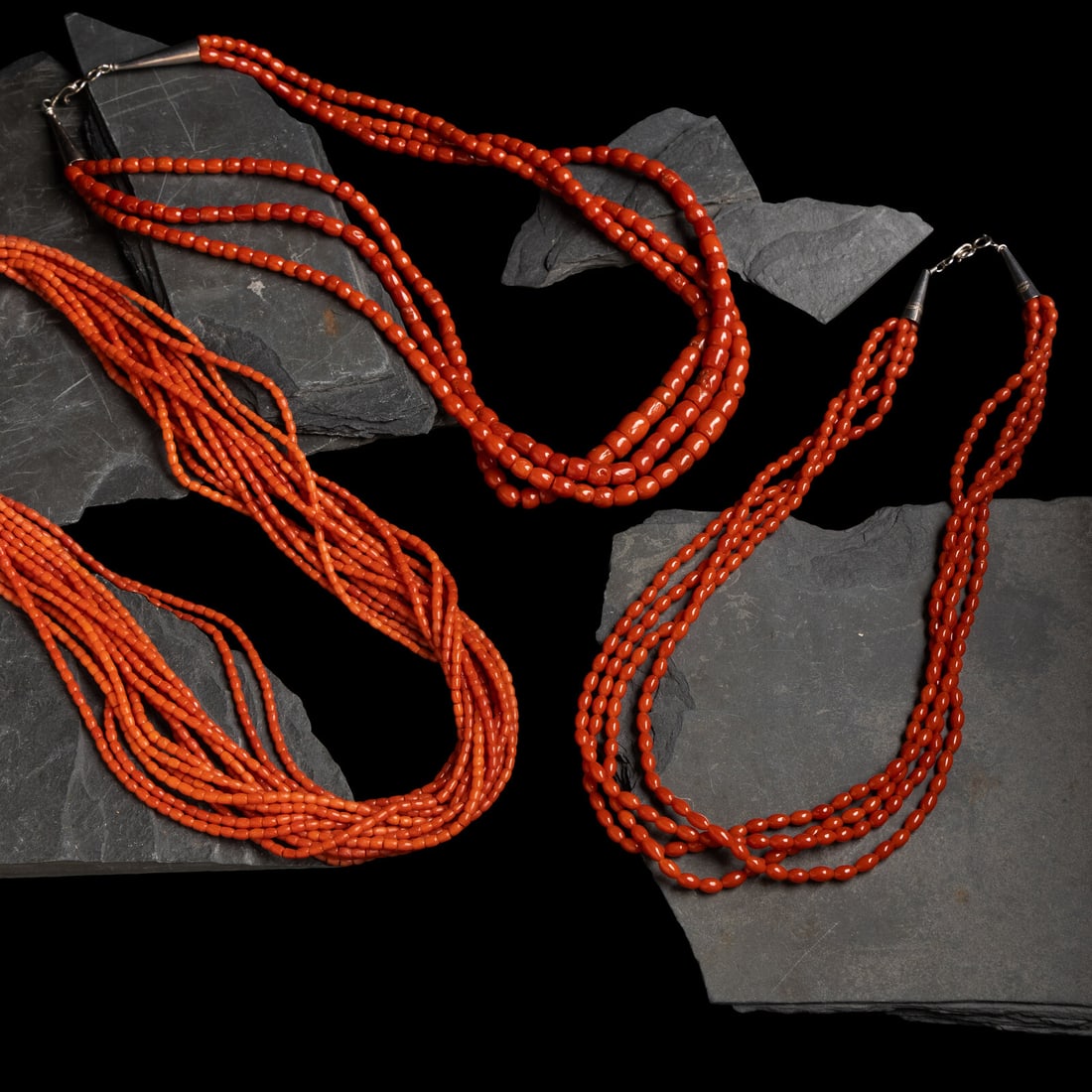 Southwestern-style Multi-strand Coral Necklaces: Southwestern-style Multi-strand Coral Necklaces third quarter 20th century lot of 3, includes: a fourteen-strand example; marked on the findings STERLING with three rainclouds length 21 inches weight