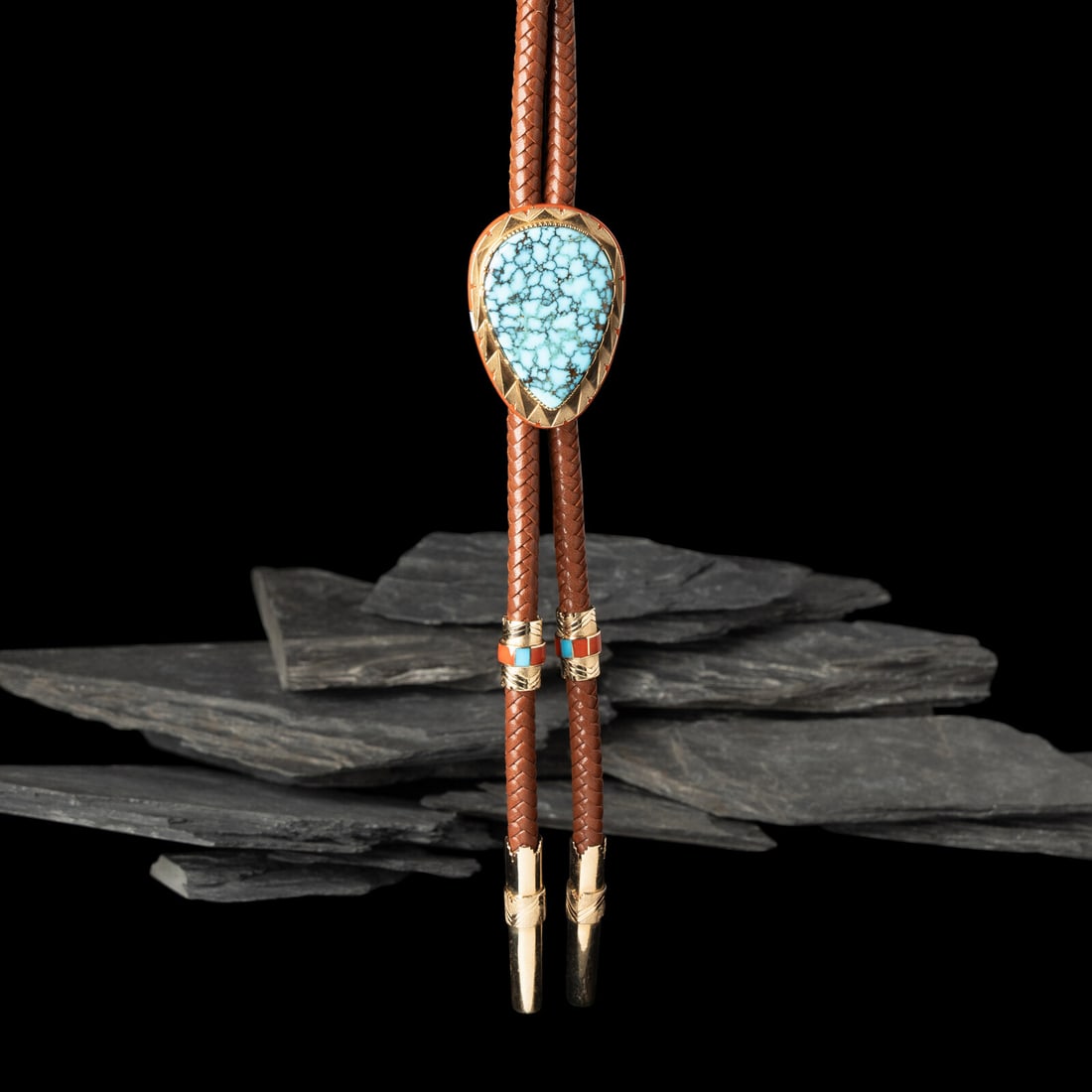 Leo Lando Yazzie (DinÈ, act. since 1970s) 14k Gold, Nevada Blue Turquoise, Coral, and Opal Bolo: Leo Lando Yazzie (DinÈ, act. since 1970s) 14k Gold, Nevada Blue Turquoise, Coral, and Opal Bolo Tie the slide, set with a central teardrop-shaped turquoise cabochon and coral and opal channel inl
