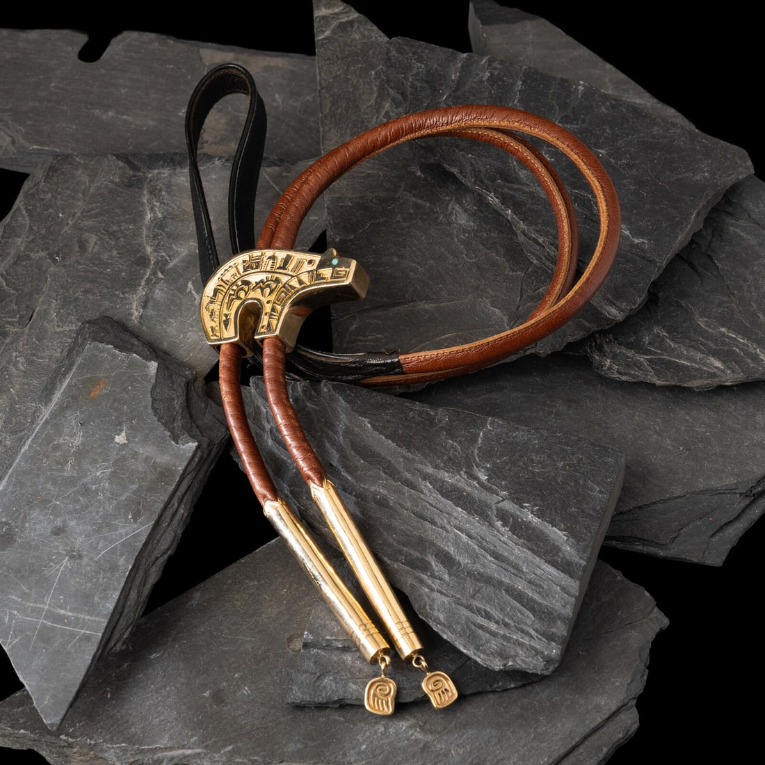 Herbert Taylor (DinÈ, 1951-1996) 14K Gold Bear Bolo Tie: Herbert Taylor (DinÈ, 1951-1996) 14K Gold Bear Bolo Tie reversible slide with storyteller scene on one side and Kokopelli and lizard on the other; the eyes set with turquoise; the finial feature 