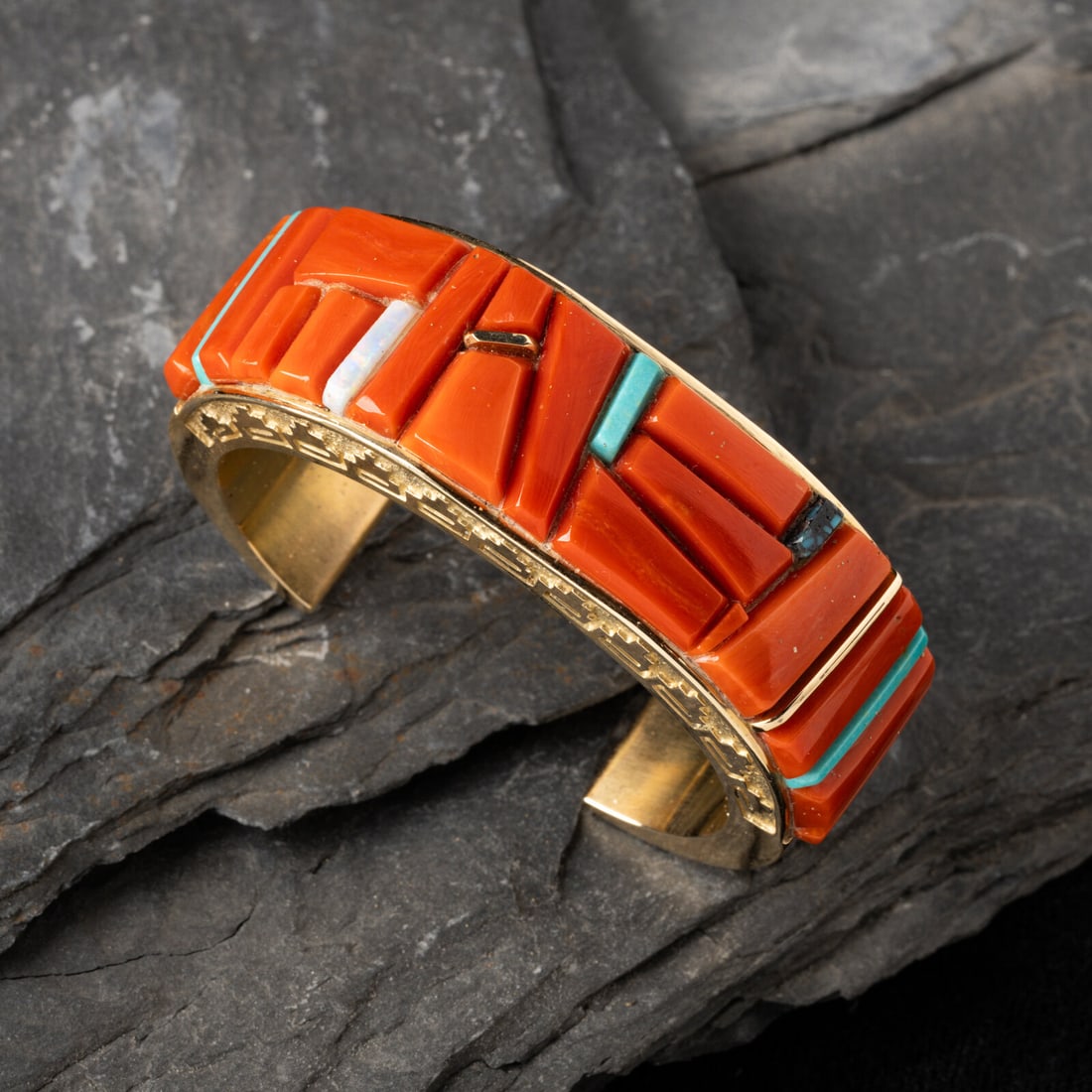 Abraham Begay (DinÈ, b. 1953) 14k Gold and Cobblestone Inlay Cuff Bracelet: Abraham Begay (DinÈ, b. 1953) 14k Gold and Cobblestone Inlay Cuff Bracelet set with coral, turquoise, and opal; marked 14K and signed Abraham Begay on interior width 7/8 inch interior circumferen