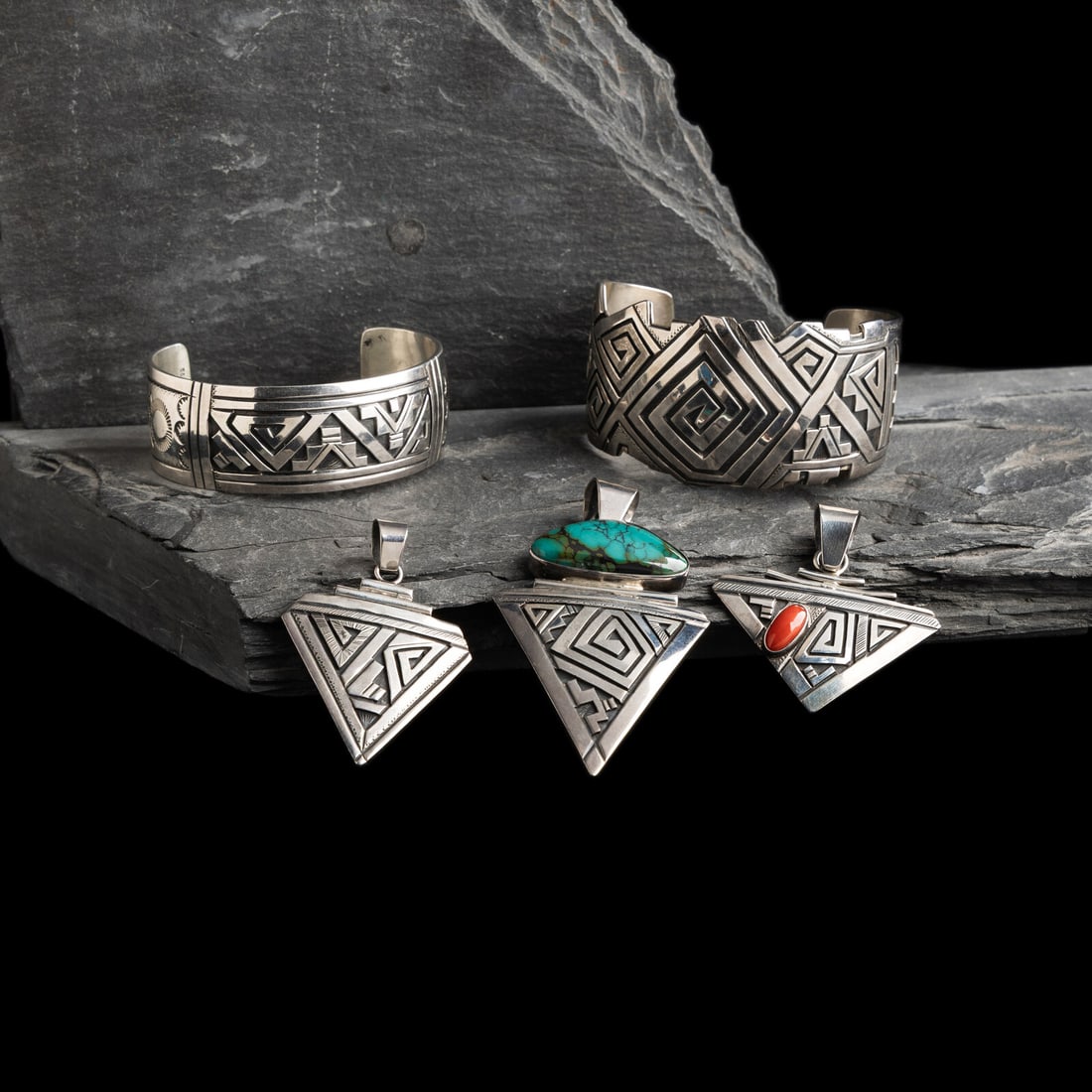Peter Nelson (DinÈ, b. 1954) Collection of Sterling Silver Cuff Bracelets and Pendants: Peter Nelson (DinÈ, b. 1954) Collection of Sterling Silver Cuff Bracelets and Pendants lot of 5, includes: two cuff bracelets sizes: interior circumference 5-1/2 inches + gap length 1-1/4 inches 