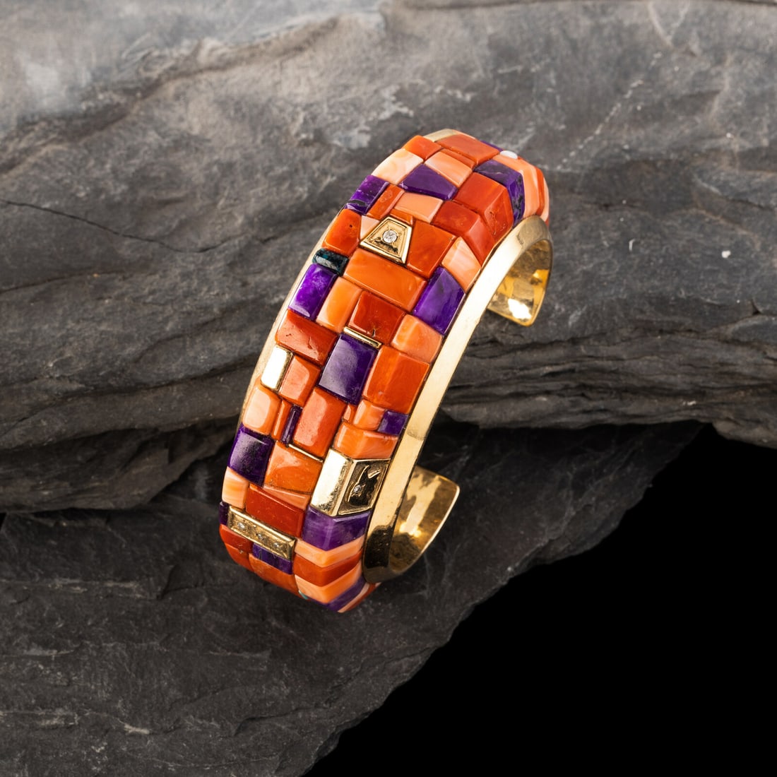 Vernon Haskie (DinÈ, b. 1968) 14K Gold and Cobblestone Inlay Cuff Bracelet: Vernon Haskie (DinÈ, b. 1968) 14K Gold and Cobblestone Inlay Cuff Bracelet set with coral, sugilite, turquoise, and diamonds; marked 14K VH on interior width 1-1/4 inches interior circumference 5
