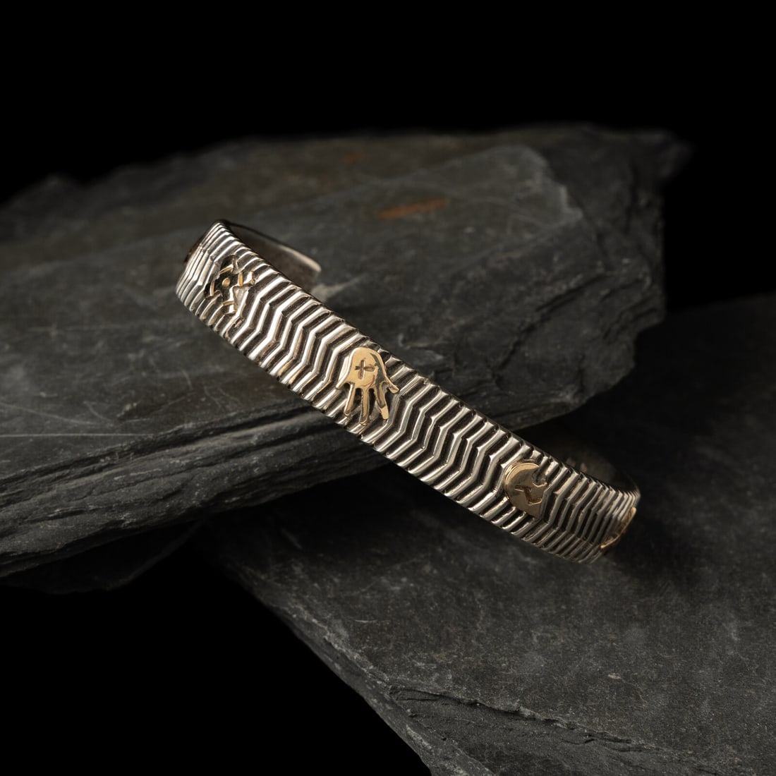 Kee Yazzie (DinÈ, b. 1969) Sterling Silver and 14K Gold Petroglyph Cuff Bracelet: Kee Yazzie (DinÈ, b. 1969) Sterling Silver and 14K Gold Petroglyph Cuff Bracelet signed KEE and marked STERLING 14k © on interior width 3/4 inch interior circumference 5-3/8 inches + gap len