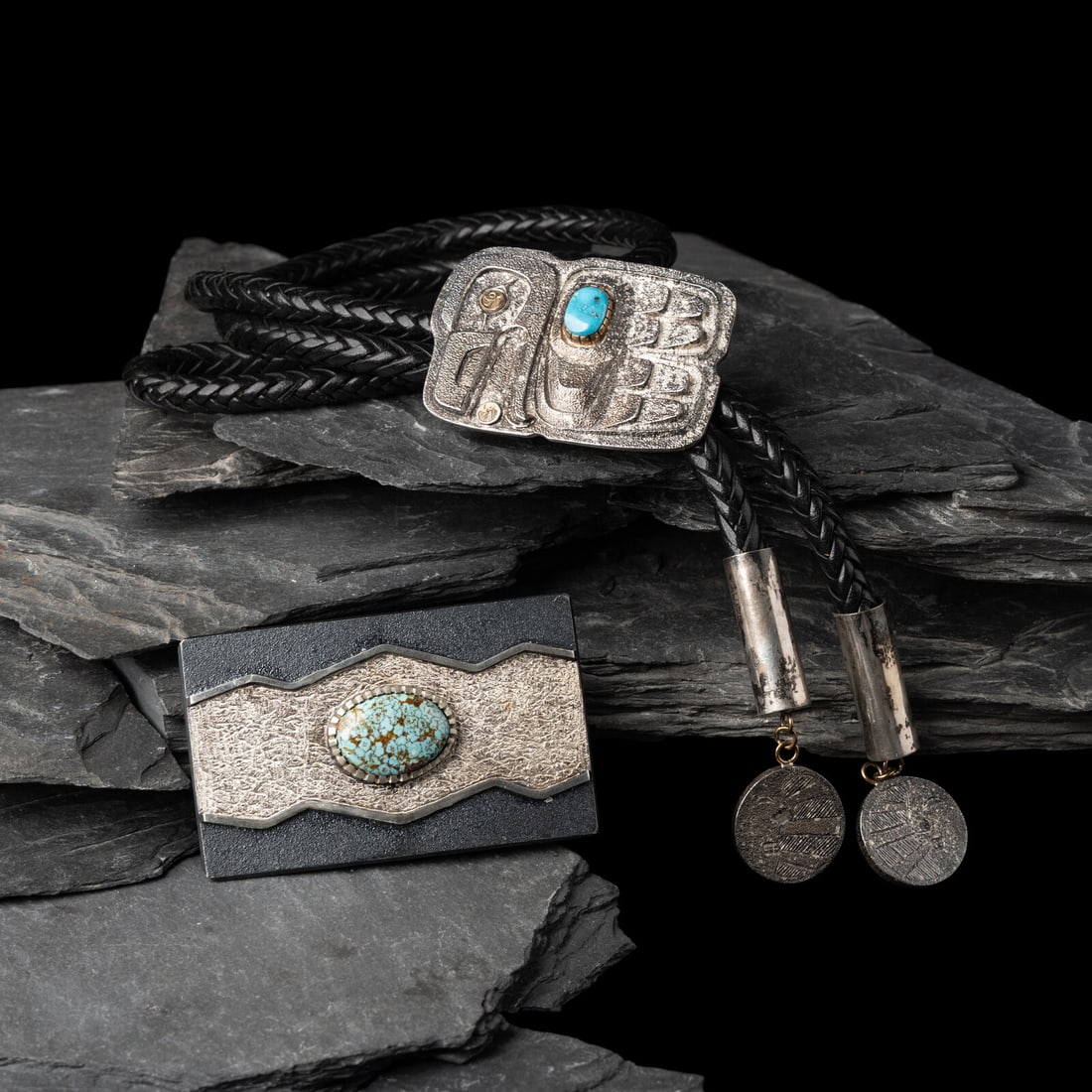 Northwest Coast and Navajo Silver and Turquoise Men's Wear Jewelry: Northwest Coast and Navajo Silver and Turquoise Men's Wear Jewelry 21st century lot of 2, includes: a bolo tie featuring a siler slide with Northwest Coast Eagle; marked TPC on back slide length 2-1/2