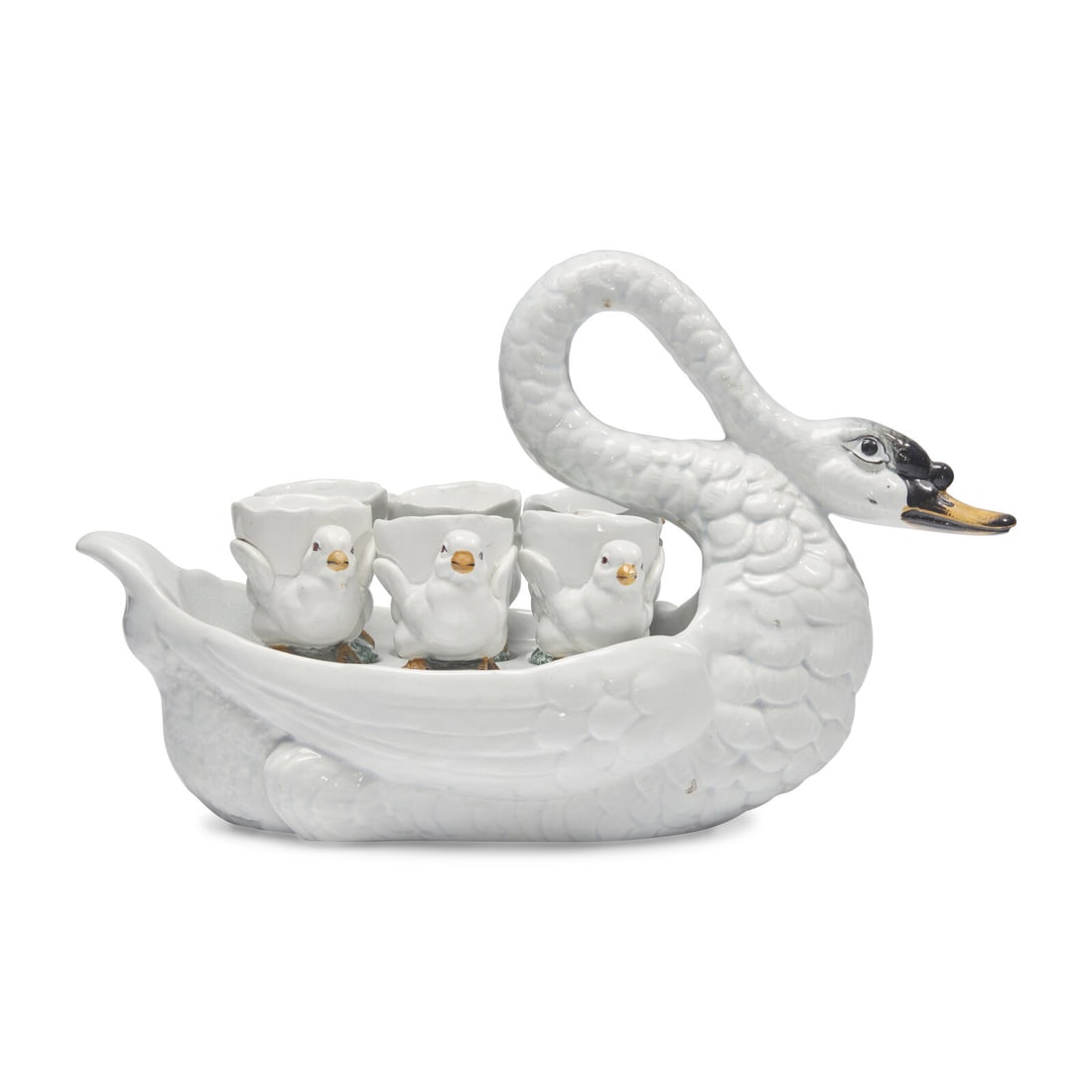 A French Majolica Swan Form Server: A French Majolica Swan Form Server Georges Dreyfus, Paris, Late 19th Century with six cygnet-form egg cups; each with transfer-printed "G.D./ Paris/ Déposé" label to underside. Height of swa
