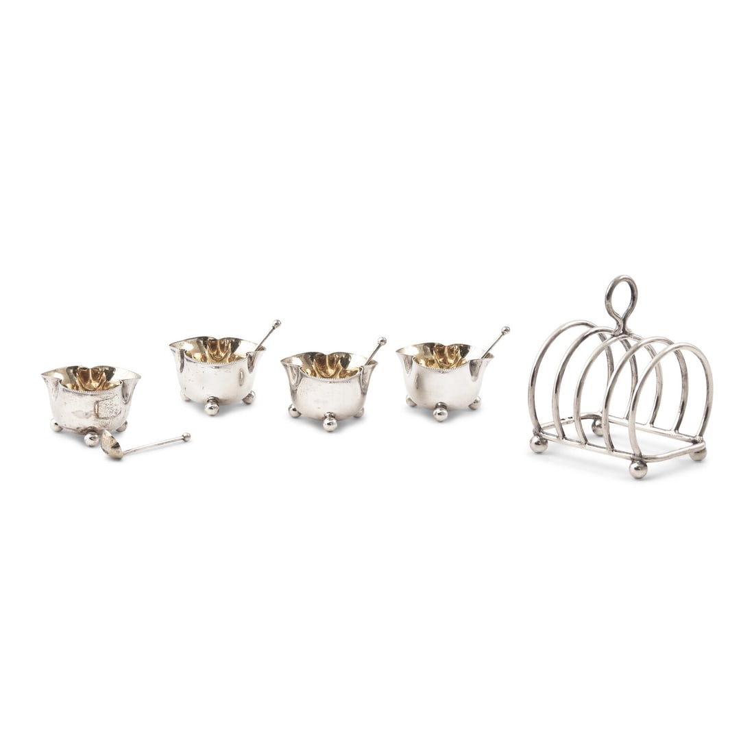 A Set of Four English Silver Trefoil Salt Cellars and a Silver Toast Rack (1 of 4)
