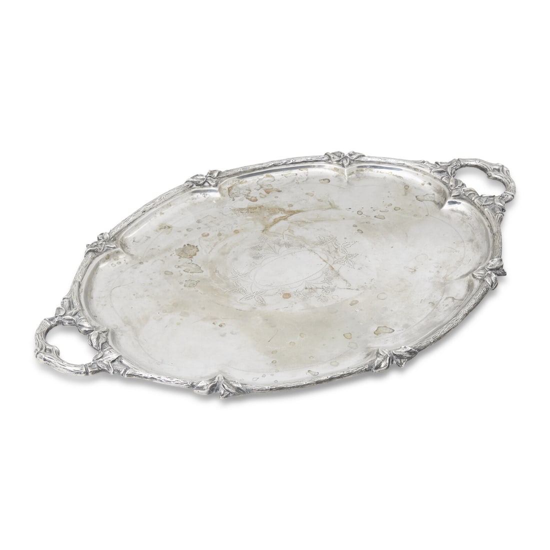 A French Silver Tray: A French Silver Tray 1819-1838 of oval form, with branch and leaf-form handles and rim, the center engraved with oval cartouche surrounded by foliate motifs, marked with Paris standard mark indicating