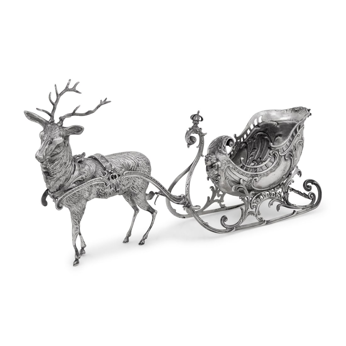 A Continental Silver-Plate Sleigh and Reindeer Centerpiece: A Continental Silver-Plate Sleigh and Reindeer Centerpiece 20th Century apparently unmarked. Height 9 x length 19 inches. This lot is located in Chicago.