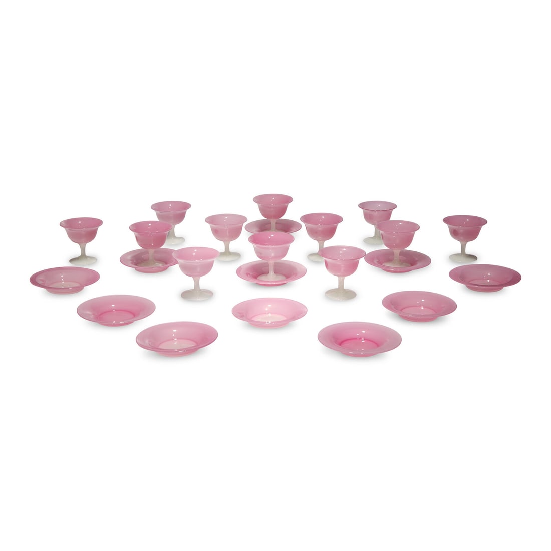 A Steuben Carder Rose Glass Table Service: A Steuben Carder Rose Glass Table Service Designed by Frederick Carder, Early 20th Century comprising twelve dessert cups and eleven saucers; 23 items total. Height 3 3/4 x diameter 4 inches (cups,