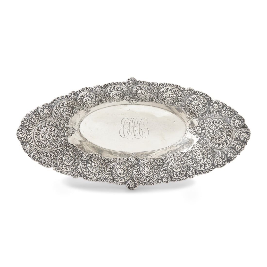 An American Aesthetic Movement Silver Repousse Bread Dish: An American Aesthetic Movement Silver Repousse Bread Dish Gorham Mfg. Co., Providence, RI, Date Mark for 1880 of oblong form, with swirl motifs to rim, the well engraved with monogram, "CHC", marked t