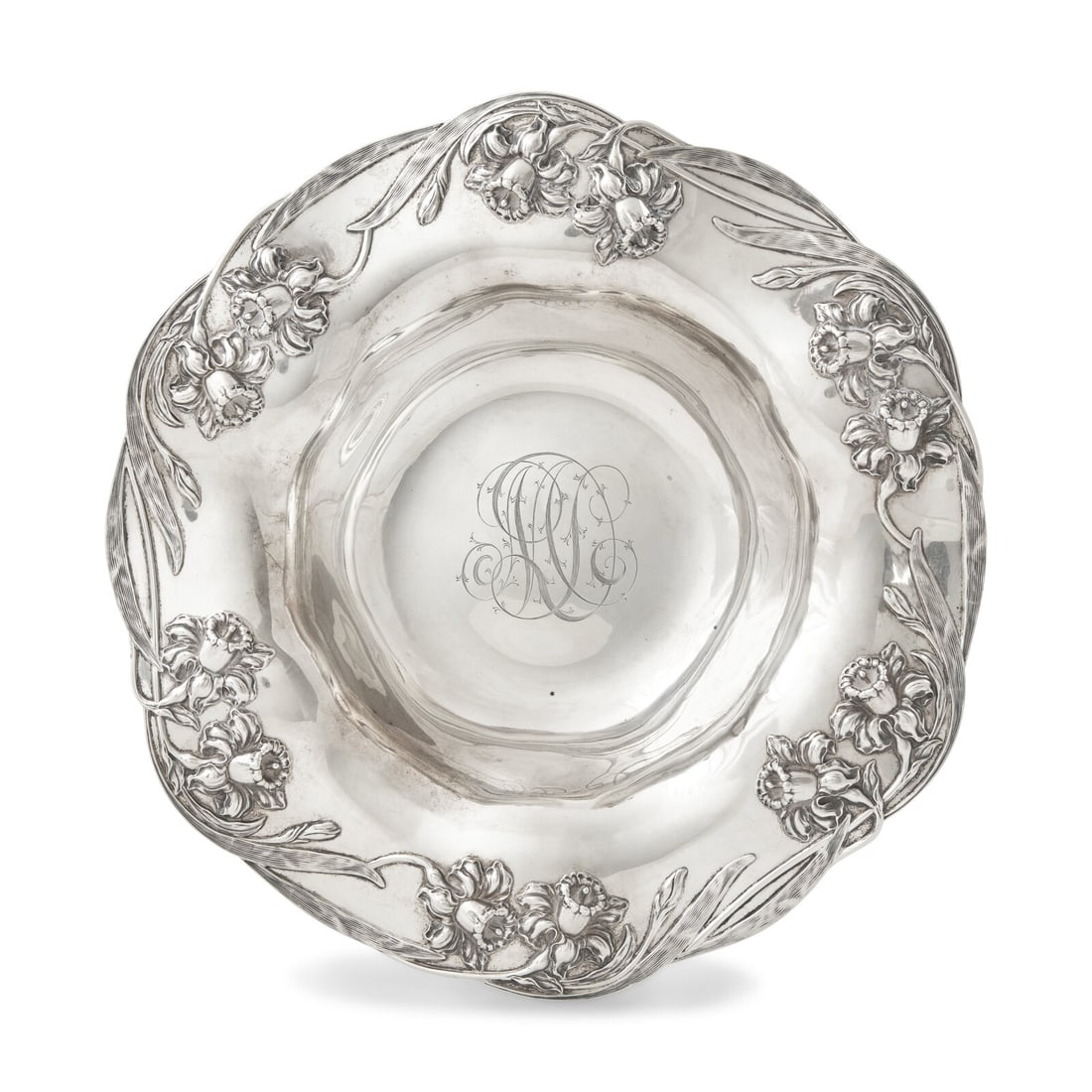An American Silver Floral Cast Bowl: An American Silver Floral Cast Bowl Towle Silversmiths, Newburyport, MA, Early 20th Century Retailed by J.E. Caldwell and Co., Philadelphia, with scalloped rim, cast and chased with daffodils, the wel