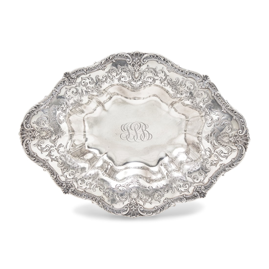 An American Silver Repousse Bowl: An American Silver Repousse Bowl Graff, Washbourne, and Dunn (c. 1899-1961), New York, NY, Early 20th Century of oblong form, lobed body, the rim engraved with scrolls, foliate motifs, and bellflower 
