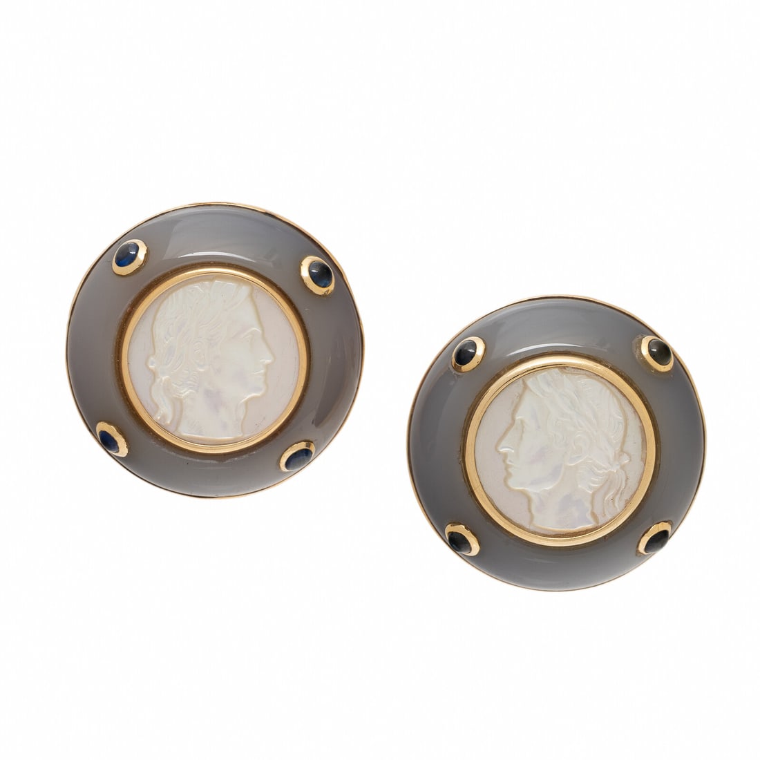 Trianon, Mother-of-Pearl Cameo, Chalcedony, Sapphire, and Yellow Gold Earrings: Trianon, Mother-of-Pearl Cameo, Chalcedony, Sapphire, and Yellow Gold Earrings Mother-of-pearl cameos measuring approximately 13.75 mm, carved chalcedony, and round cabochon sapphires. Yellow gold.