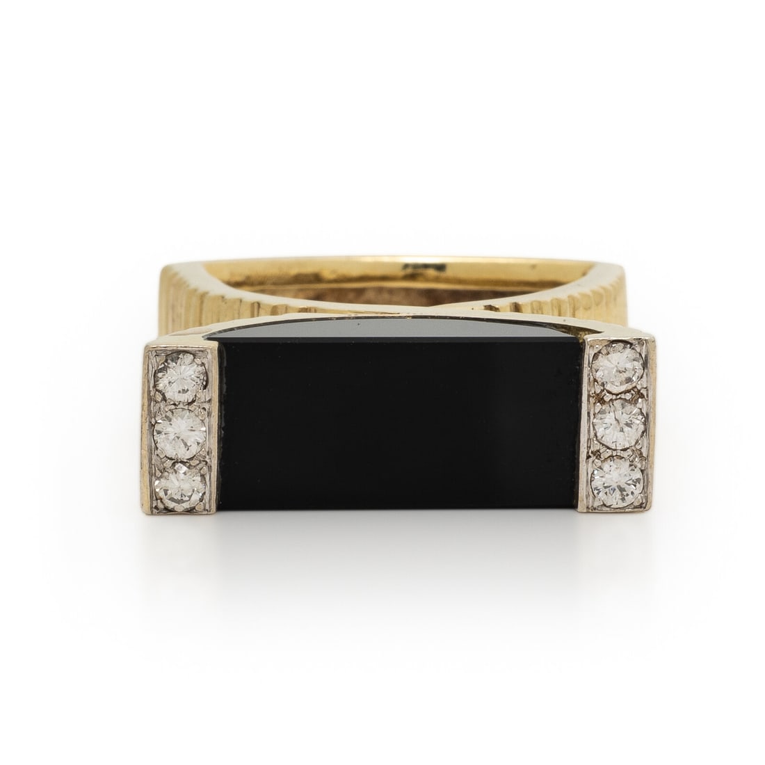 La Triomphe, Onyx, Diamond, and Yellow Gold Ring: La Triomphe, Onyx, Diamond, and Yellow Gold Ring Round diamonds weighing approximately 0.35 carat total and carved onyx. 14 karat ribbed yellow gold. Ring size 5 1/2. Stamp: La Triomphe 14K. Gross