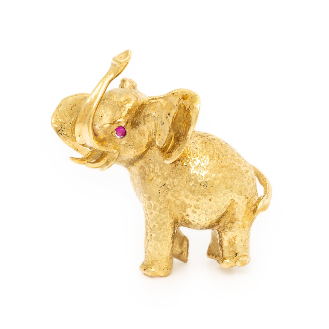 Yellow Gold and Ruby Elephant Brooch: Yellow Gold and Ruby Elephant Brooch Round cabochon ruby eyes. 18 karat yellow gold. 1 1/2 x 1 1/2 inches. Stamp: 18K. Gross weight: 12.30 dwt. Property from an Important Private Collection, Florida