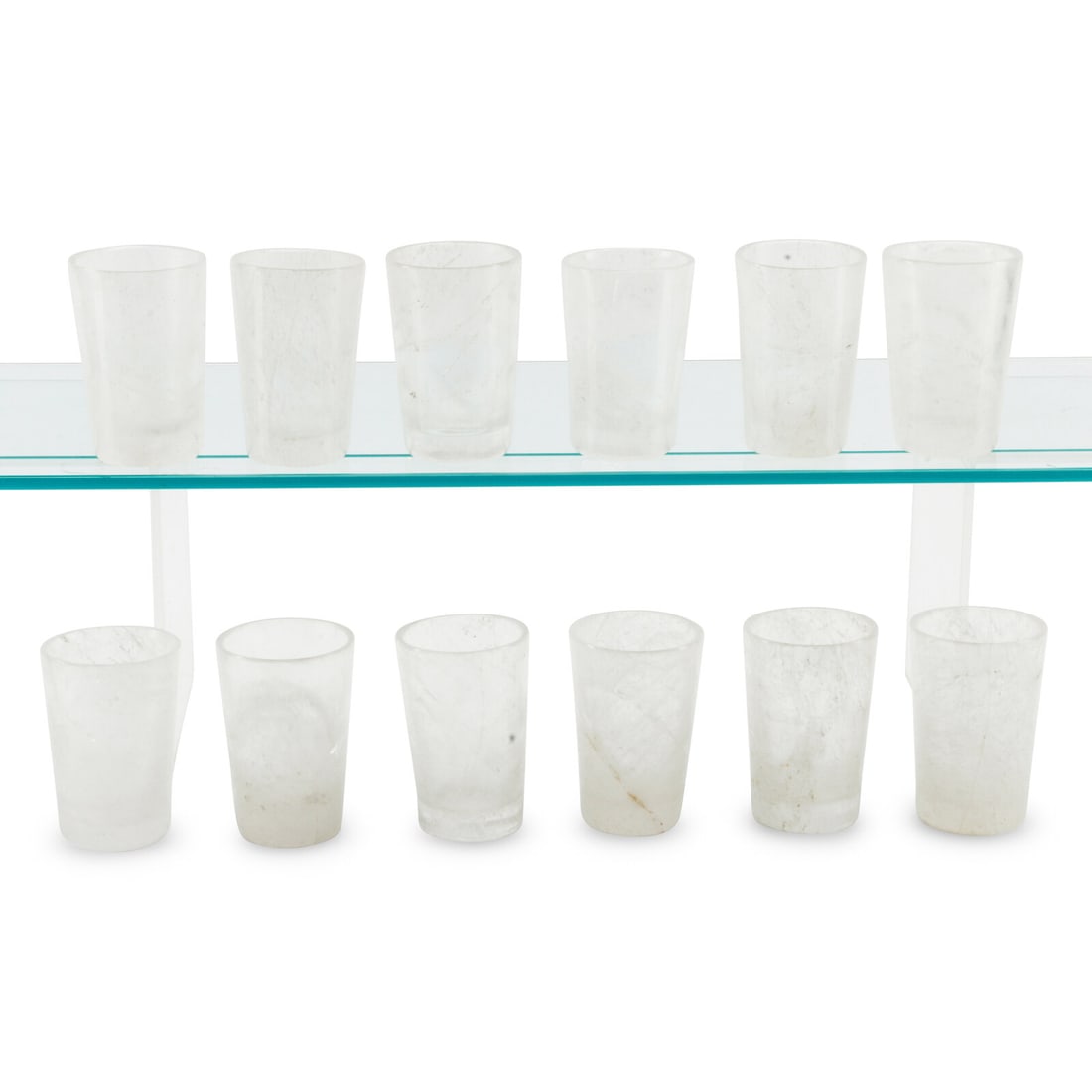 A Set of Twelve Carved Rock Crystal Tumblers: A Set of Twelve Carved Rock Crystal Tumblers Height 5 x diameter 3 inches. This lot is located in Chicago.