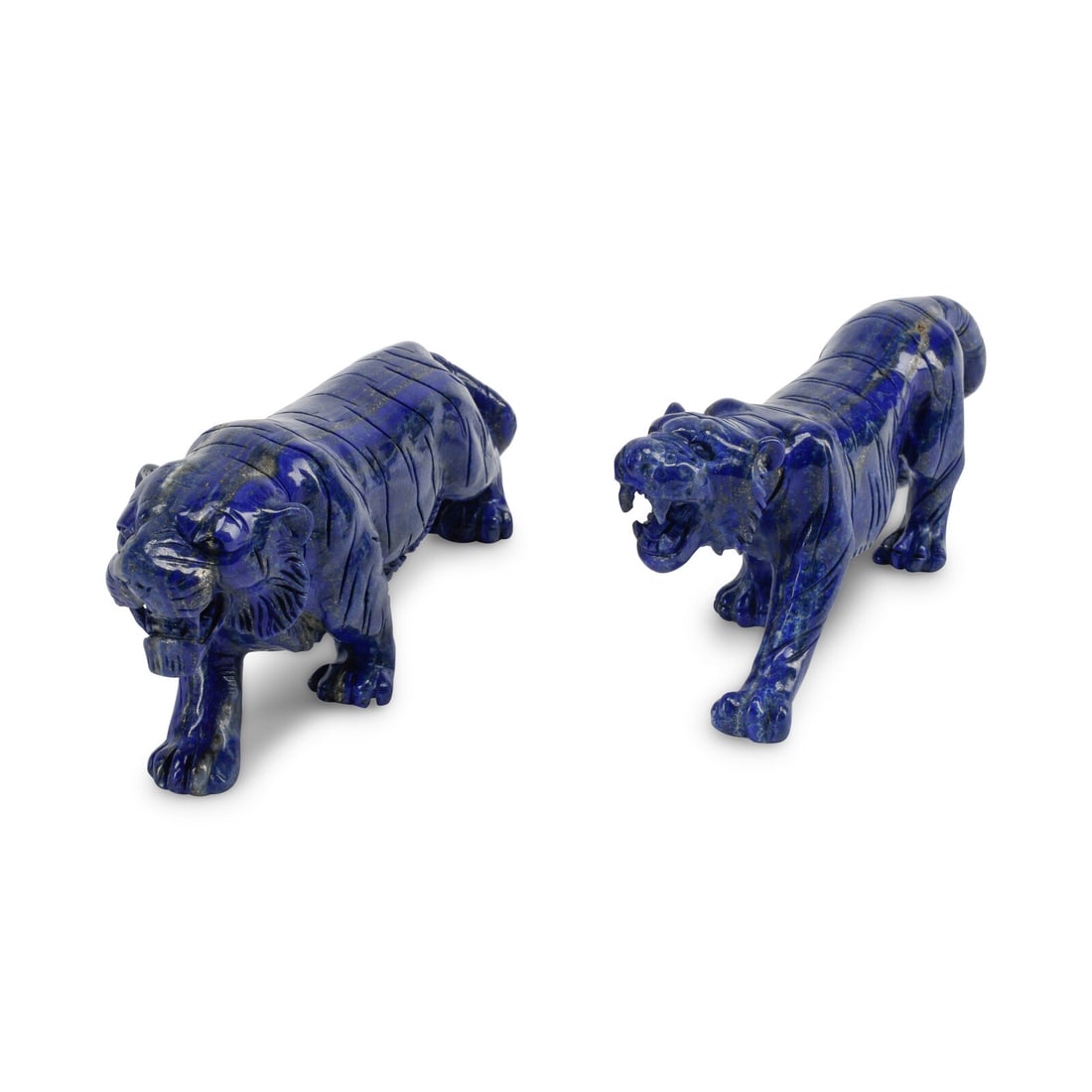 A Pair of Carved Lapis Lazuli Models of Tigers: A Pair of Carved Lapis Lazuli Models of Tigers 20th Century Height 3 1/2 x width 2 x length 8 1/2 inches. This lot is located in Chicago.