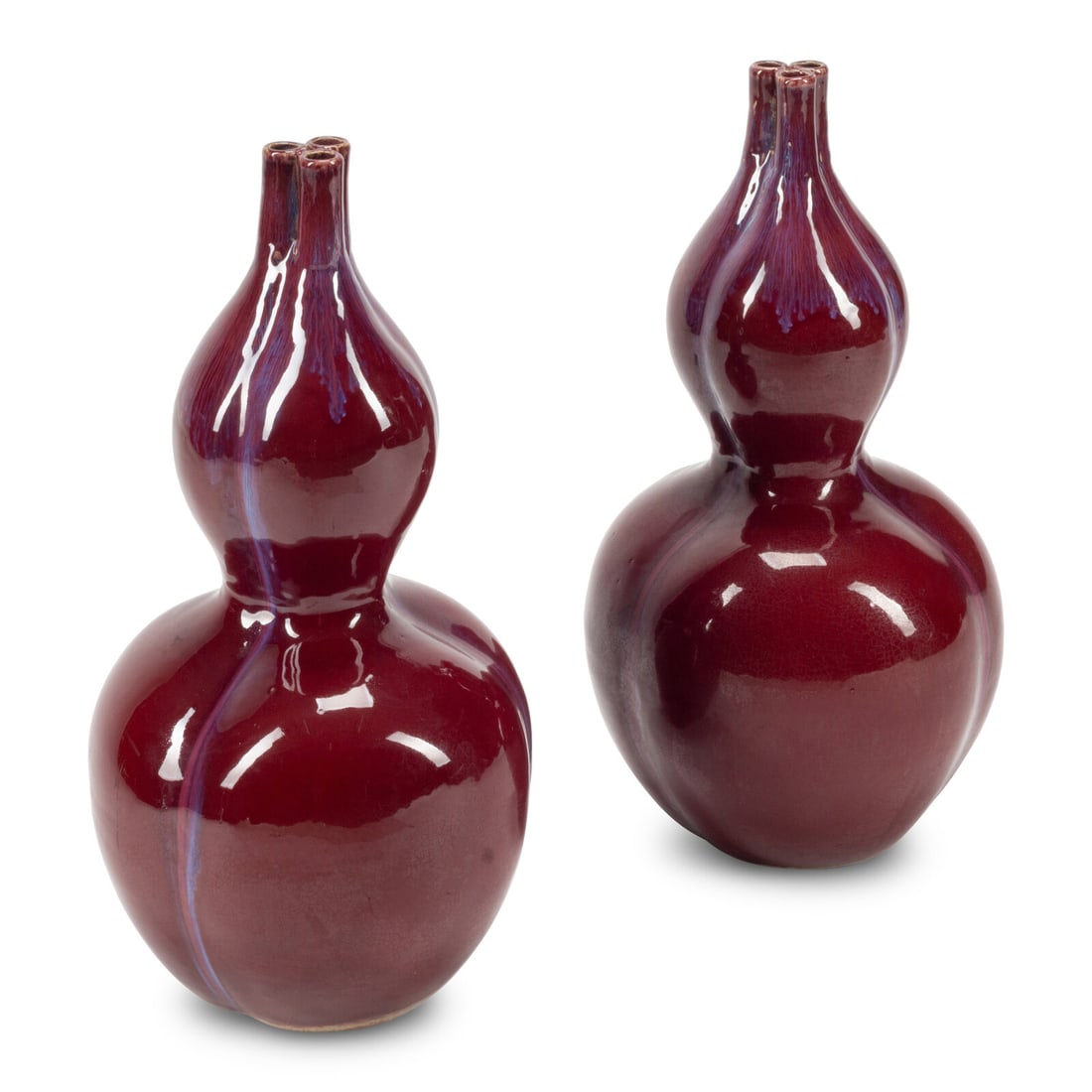 A Pair of Chinese Sang de Boeuf Vases: A Pair of Chinese Sang de Boeuf Vases 20th Century Height 23 x diameter 12 inches. This lot is located in Chicago.