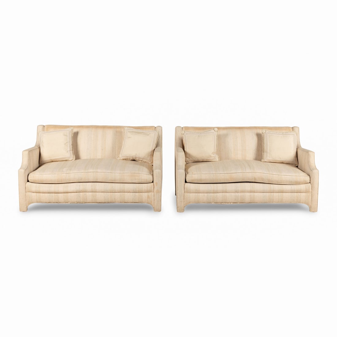 A Pair of Custom Cream Slub-Silk Upholstered Settees: A Pair of Custom Cream Slub-Silk Upholstered Settees 20th Century each having two throw-pillows. Height 29 x width 54 x depth 30 inches. Property from Strawberry Hill: The Collection of Ada and