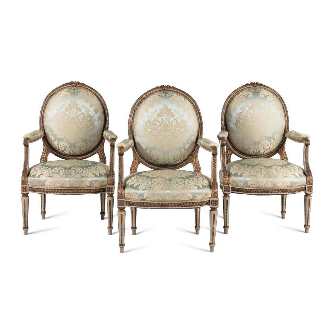 A Set Three of Louis XVI Style Grey-Painted and Parcel Gilt Fauteuils: A Set Three of Louis XVI Style Grey-Painted and Parcel Gilt Fauteuils Late 19th/Early 20th Century Height 41 x width 26 x depth 20 inches. Property from Strawberry Hill: The Collection of Ada and