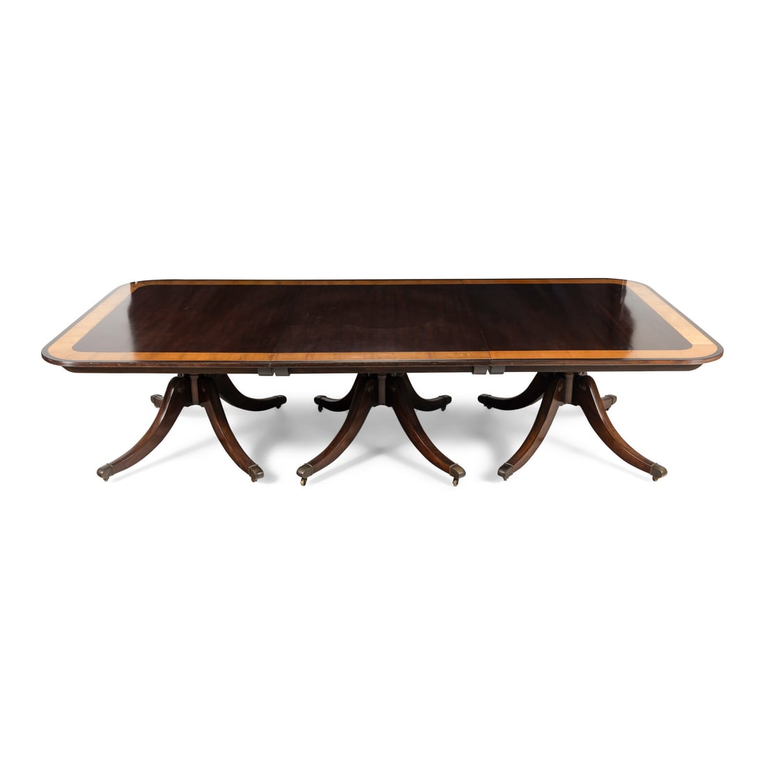 A Regency Style Mahogany and Satinwood Three-Pedestal Dining Table (1 of 11)