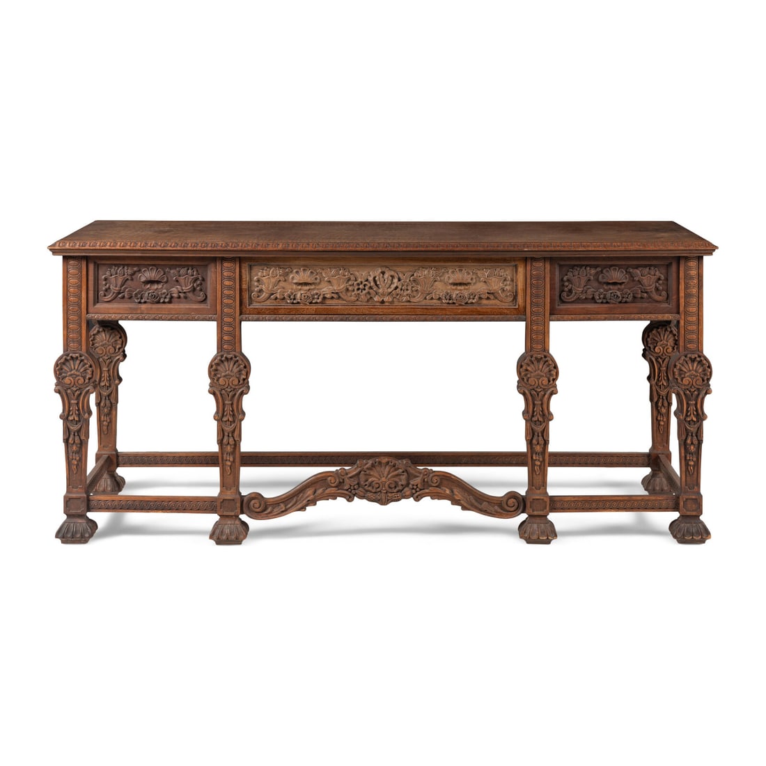 An Italian Baroque Style Carved Walnut Serving Table: An Italian Baroque Style Carved Walnut Serving Table Circa 1930-40 Height 36 x width 78 x depth 22 1/4 inches. Property from Strawberry Hill: The Collection of Ada and Barrie Regan, Hillsborough,