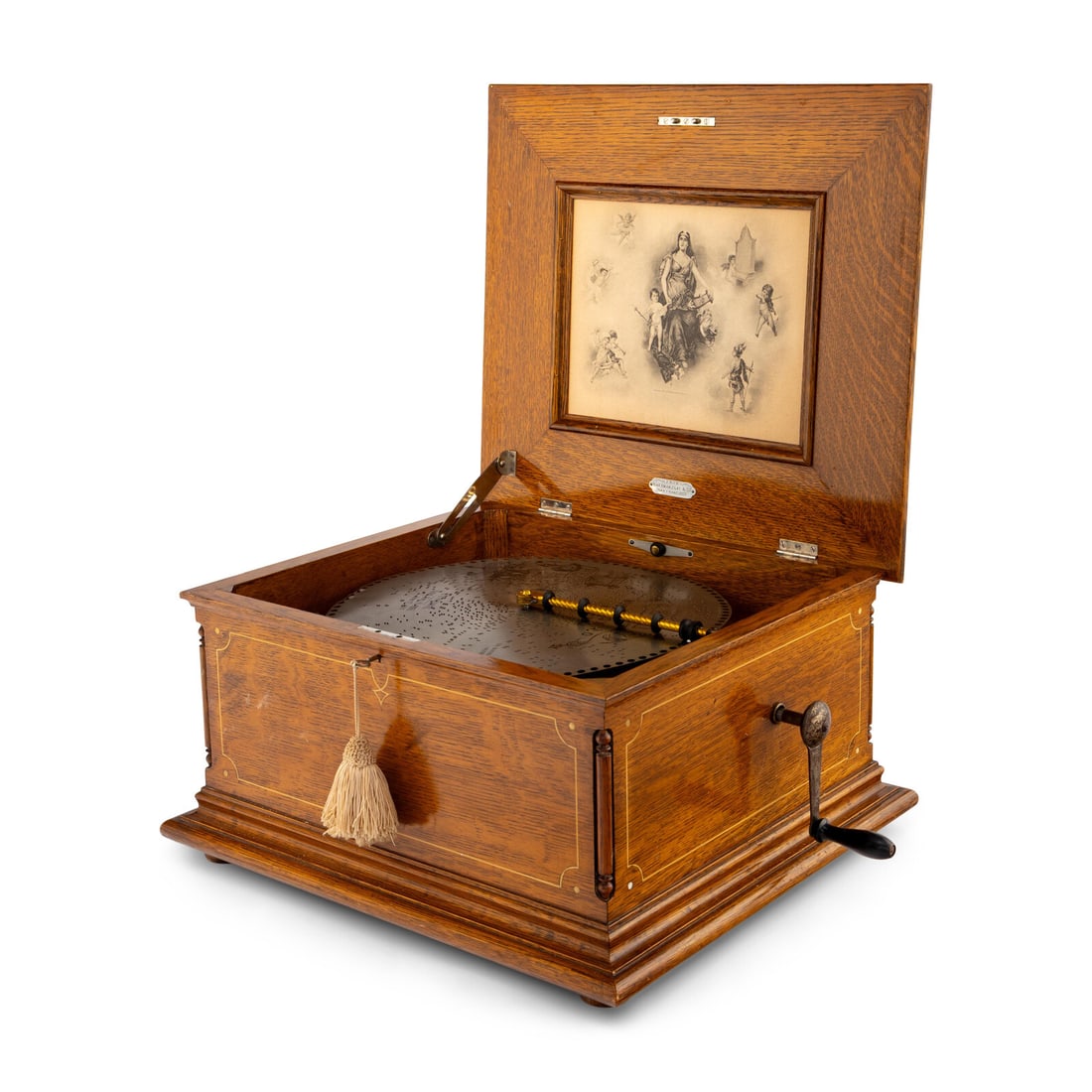 A Regina Disk Music Box: A Regina Disk Music Box Retailed by Sherman Clay and Co., San Francisco serial number '59299'; with 27 disks. Height 14 x width 22 x depth 20 inches. Property from Strawberry Hill: The Collection of