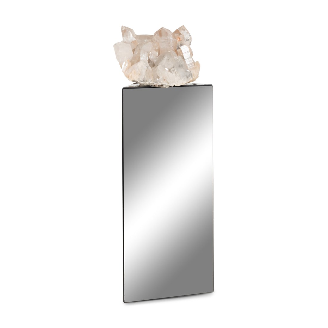 A Large Rock Crystal Specimen: A Large Rock Crystal Specimen Retailed by Arthur Court, Circa 1975 together with a mirrored pedestal. Height of specimen 9 1/2 x width 16 x depth 15 inches; height of pedestal 36 1/2 x width 16 1/4 x