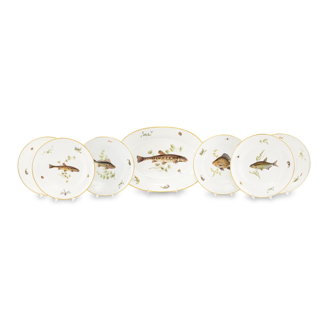 A Richard Ginori Quenelle Porcelain Fish Service: A Richard Ginori Quenelle Porcelain Fish Service comprising twelve dinner plates and two oval serving platters; 14 items total. Diameter of dinner plate 9 3/4 inches. Property from Strawberry Hill:
