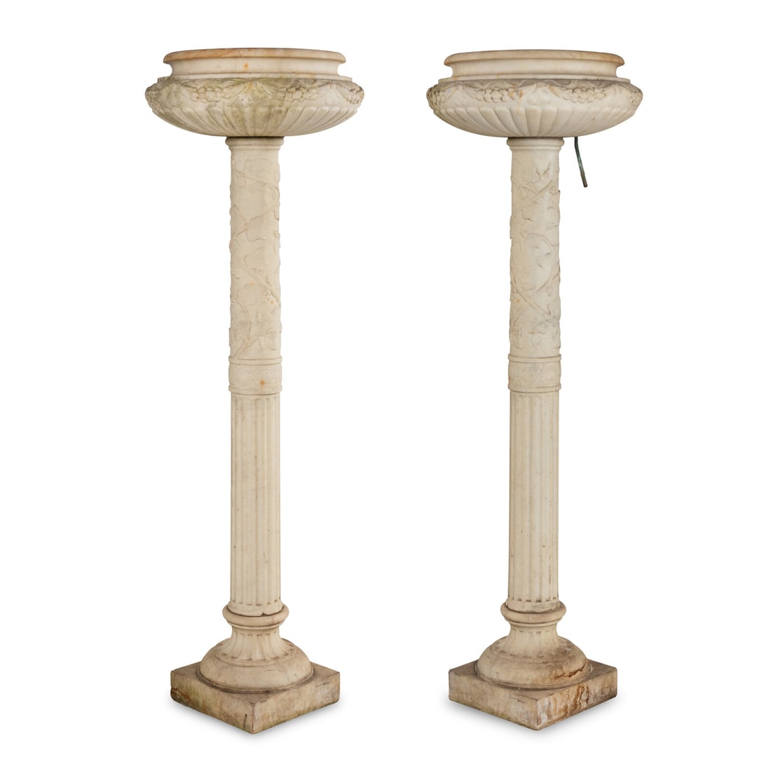 A Pair of Carved Marble JardiniËres on Pedestals: A Pair of Carved Marble JardiniËres on Pedestals Late 19th/Early 20th Century previously drilled and plumbed for irrigation. Height 65 x diameter 22 inches. Property from Strawberry Hill: The