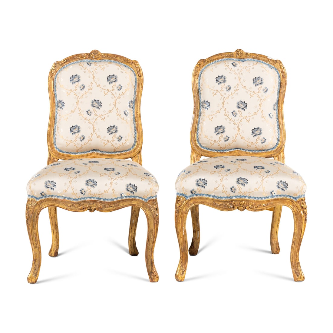 A Pair of Louis XV Carved Giltwood Chaises ‡ la Reine: A Pair of Louis XV Carved Giltwood Chaises ‡ la Reine Mid-18th Century bearing black painted inventory marks to the seat rails 'R565a' and 'R565b', respectively. Height 35 1/2 x width 21 x