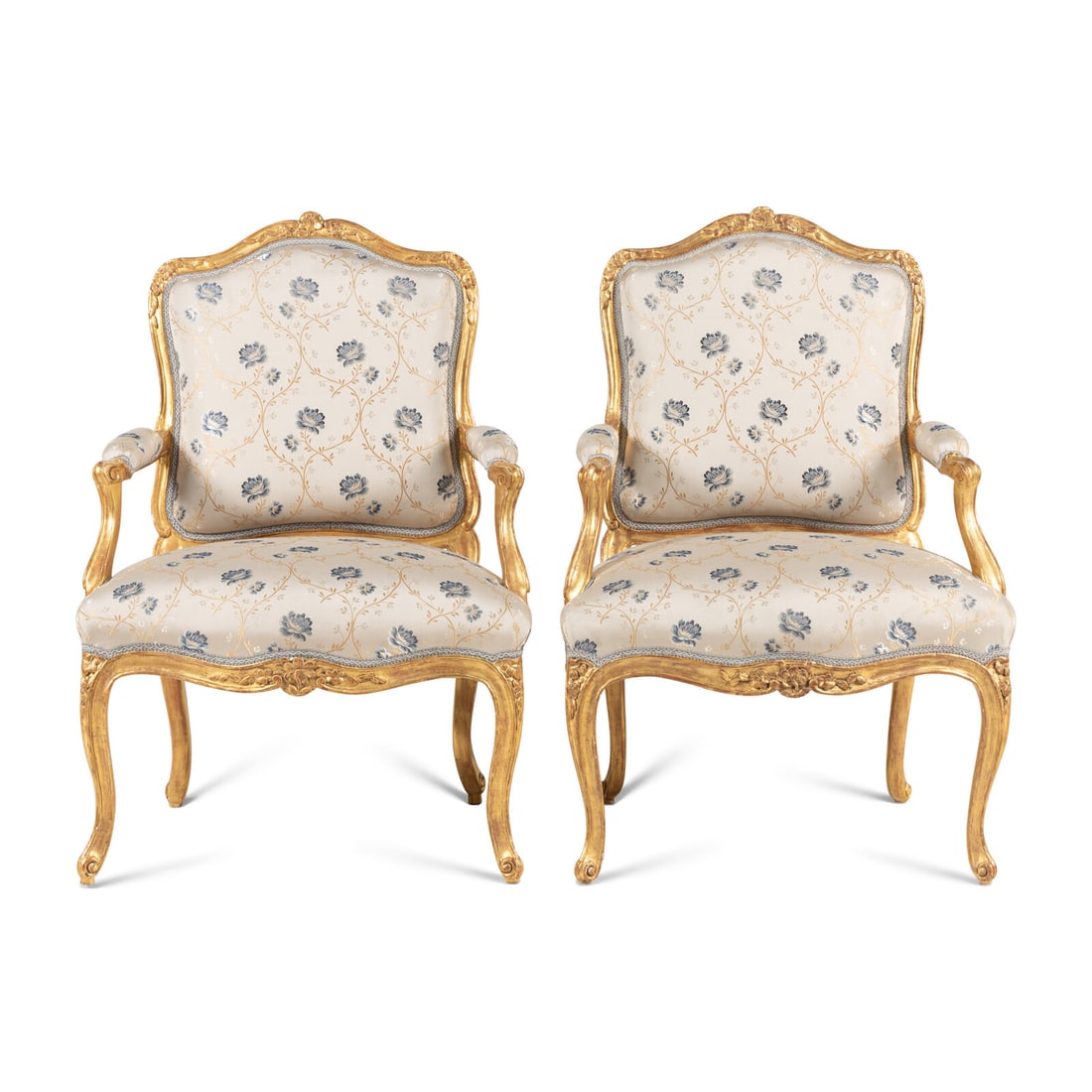 A Pair of Louis XV Carved and Giltwood Fauteuils ‡ la Reine: A Pair of Louis XV Carved and Giltwood Fauteuils ‡ la Reine Attributed to Louis Cresson (1706-1761), Circa 1740 one example stamped 'L CRESSON' to the rear seat rail. Height 38 1/2 x width 27 x