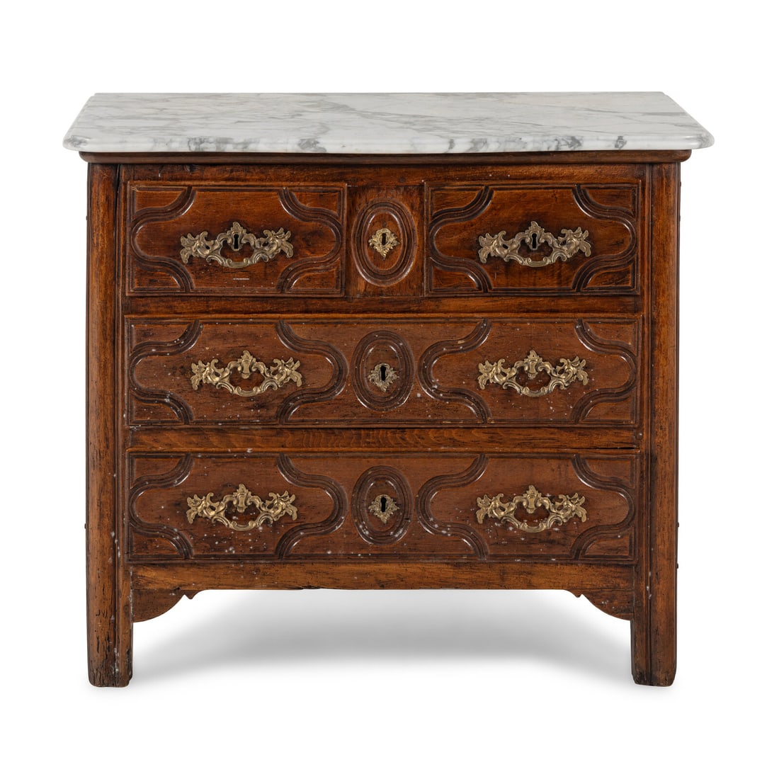 A Louis XV Walnut Marble-Top Commode: A Louis XV Walnut Marble-Top Commode Mid-18th Century Height 32 1/2 x width 37 1/2 x depth 20 inches. Property from the Collection of Patricia and Michael Corbett, Kenilworth, Illinois This lot is