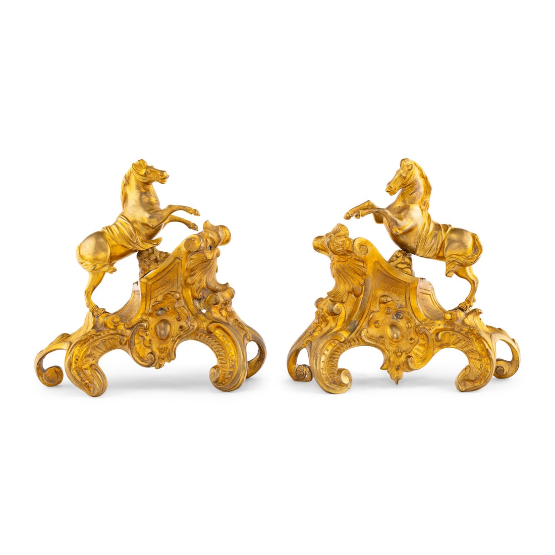 A Pair of Louis XV Gilt Bronze Chenets: A Pair of Louis XV Gilt Bronze Chenets Circa 1745-1749 each stamped several times with a crowned 'C' tax mark, which was required for bronze items above a certain weight produced in France between