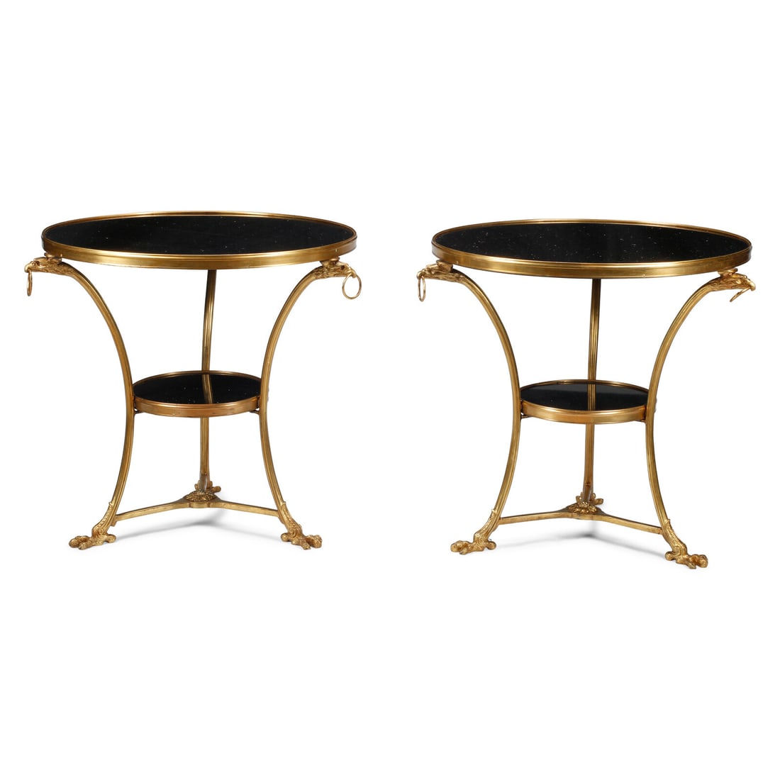 A Pair of Empire Style Gilt Bronze and Black Granite GuÈridons: A Pair of Empire Style Gilt Bronze and Black Granite GuÈridons 20th Century Height 29 x diameter of tops 29 inches. This lot is located in Chicago.