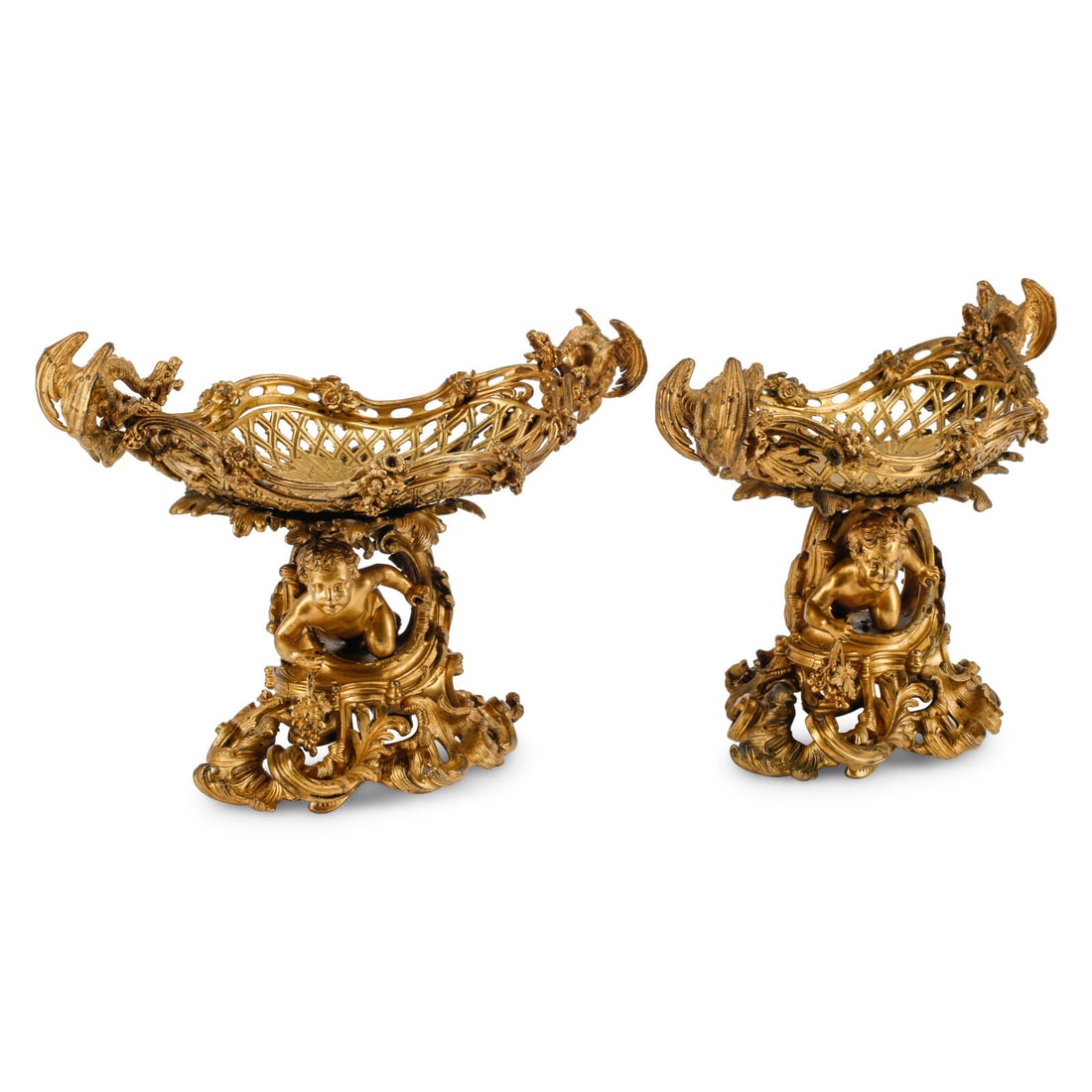 A Pair of French Gilt Bronze Figural Centerpieces: A Pair of French Gilt Bronze Figural Centerpieces 19th Century Height 13 x width 17 1/2 x depth 9 1/2 inches. This lot is located in Chicago.