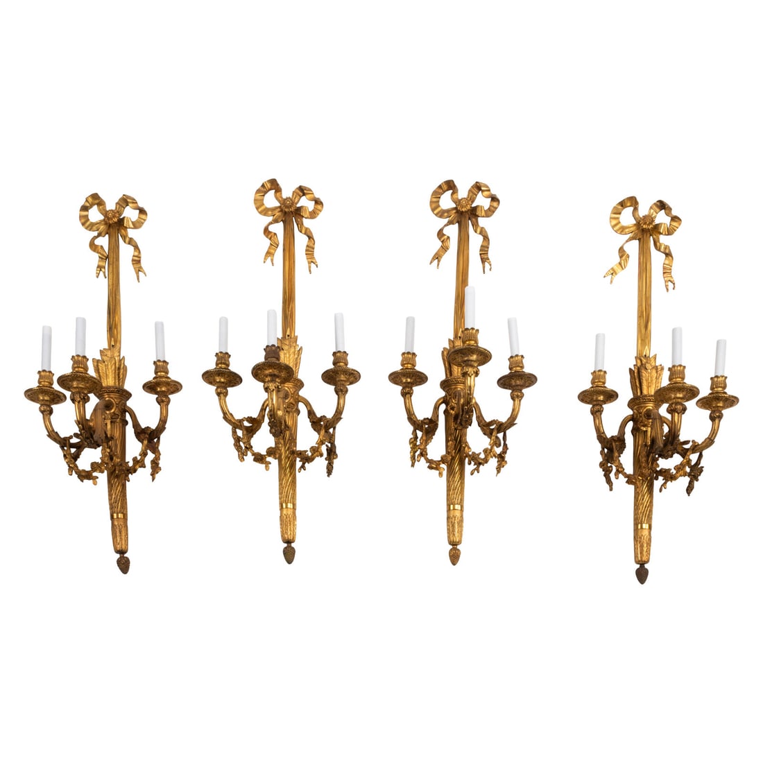 A Set of Four Large French Gilt Bronze Three-Light Sconces: A Set of Four Large French Gilt Bronze Three-Light Sconces Late 19th/ Early 20th Century Height 39 x width 14 1/2 x depth 12 inches. This lot is located in Chicago.