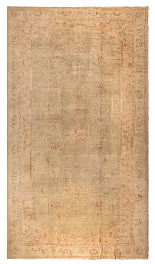An Oushak Carpet: An Oushak Carpet First Half 20th Century 19 feet 11 inches x 12 feet 7 inches. Property from a Private Family Trust This lot is located in Chicago.