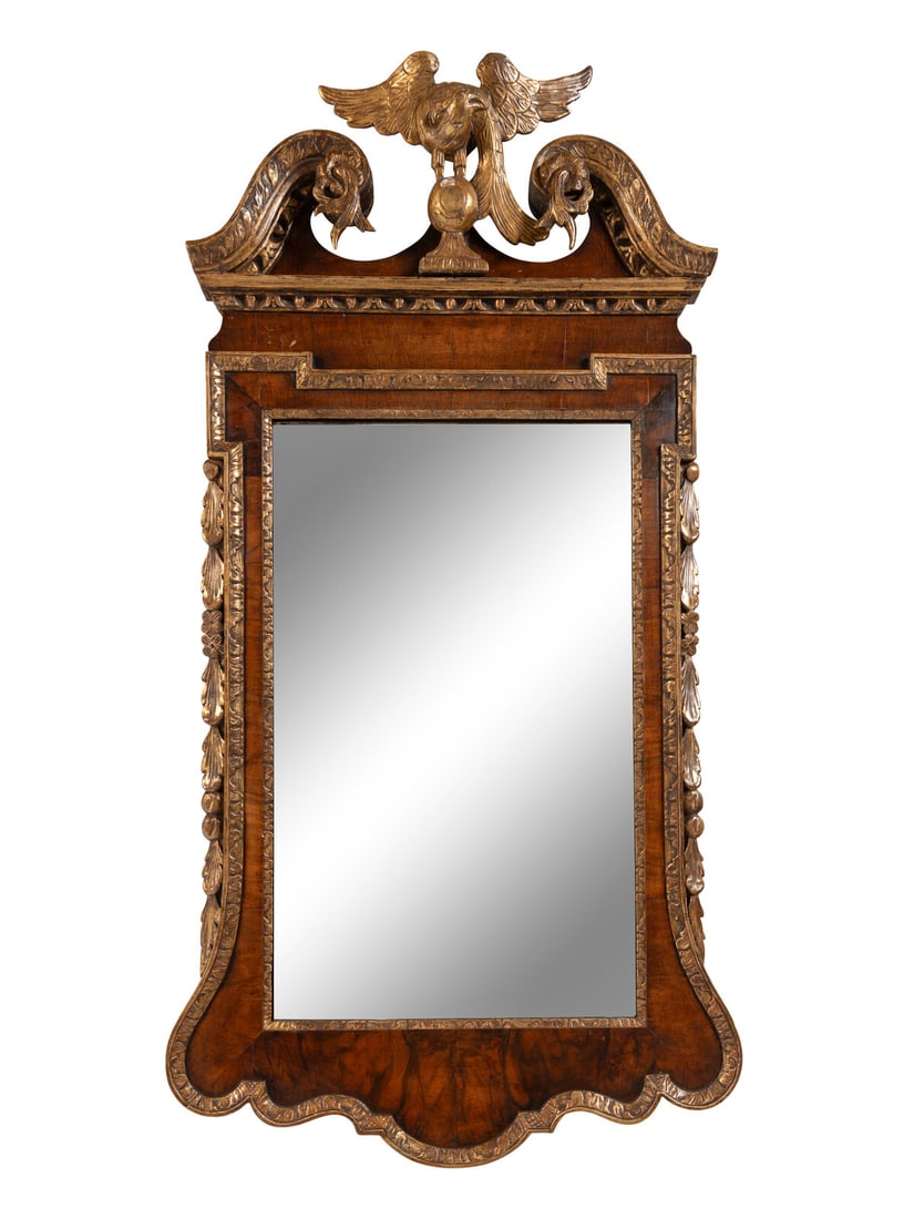 A George II Walnut and Parcel Gilt Mirror: A George II Walnut and Parcel Gilt Mirror Circa 1750 Height 53 x width 27 1/4 inches. Property from the Charlecote Antique Store, Kansas City, Missouri This lot is located in Chicago. Note: